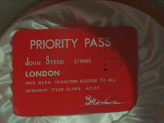 A close-up of Steed security Priority Pass, hidden inside his bowler hat