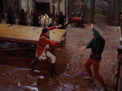 Steed and Wade fight in the main hall
