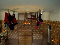 Emma and Packer fight while suspended from the ceiling