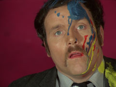Gardiner’s face is covered in paint after Tara clobbers him with her art supplies