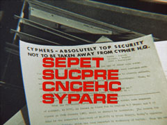 alternate title card: red all caps text reading ‘SEPET SUCPRE CNCEHC SYPARE’ superimposed on a typewritten page headed CYPHERS - ABSOLUTELY TOP SECURITY NOT TO BE TAKEN AWAY FROM CYPHER H.Q.