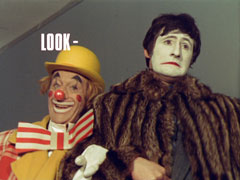 title card: white all caps text reading ‘LOOK -’ superimposed on Maxie and Jennings in their clown make-up. Maxie is smiling inanely while Jennings has a sad face