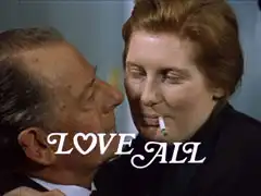 title card: white all caps text reading ‘LOVE ALL’ in an Edwardian italic, the O has been replaced with an outlined heart, superimposed on Sir Rodney embracing the cigarette-smoking char lady, Martha