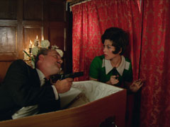 Wainwright surprises Tara by sitting up in his coffin and pointing a pistol at her